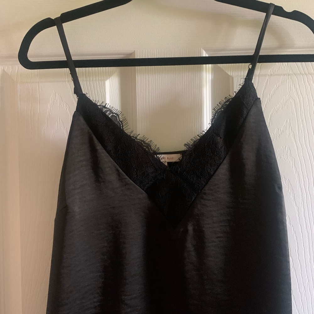 Skies are blue black silky tank top